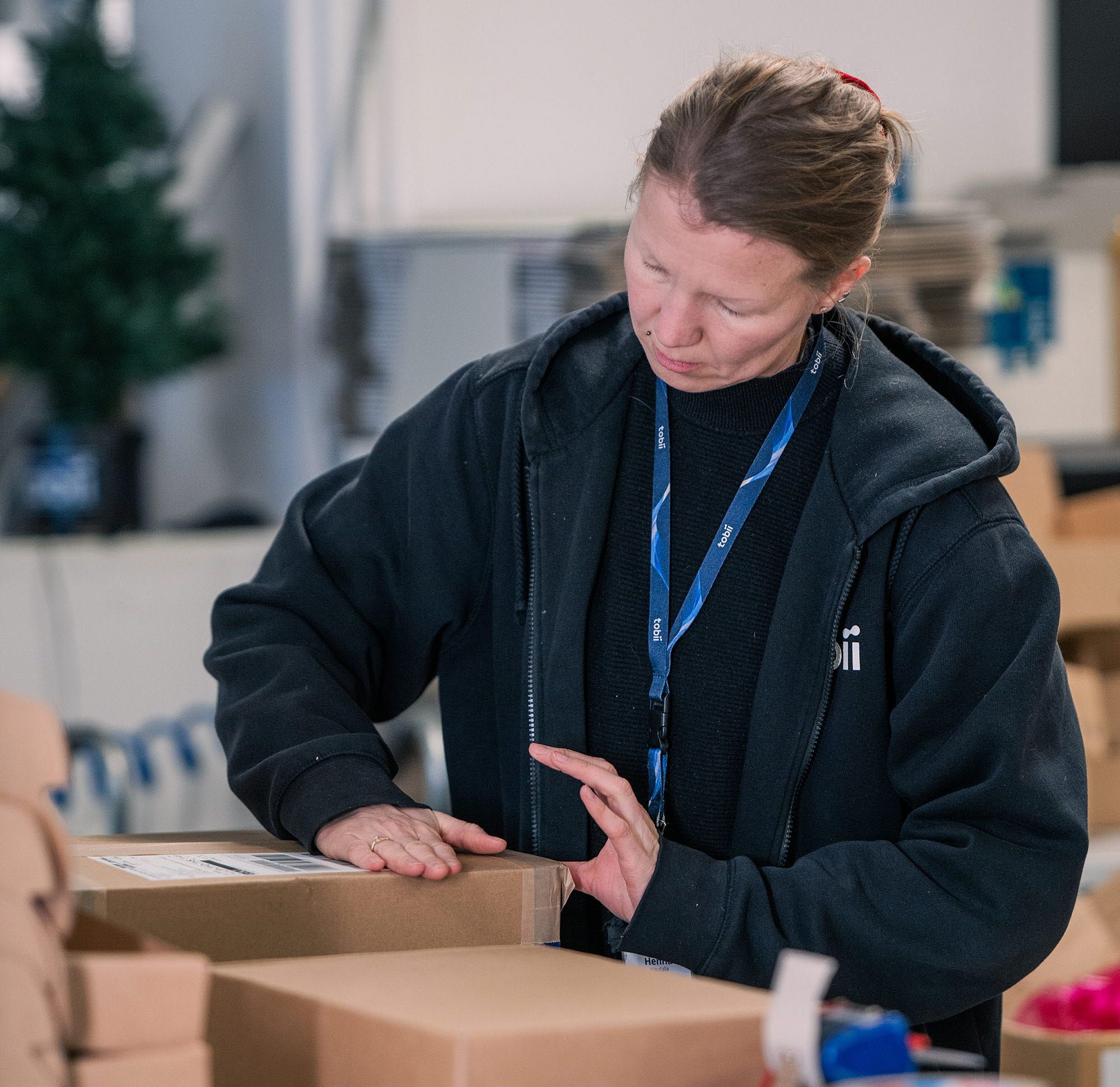 A woman packing boxes