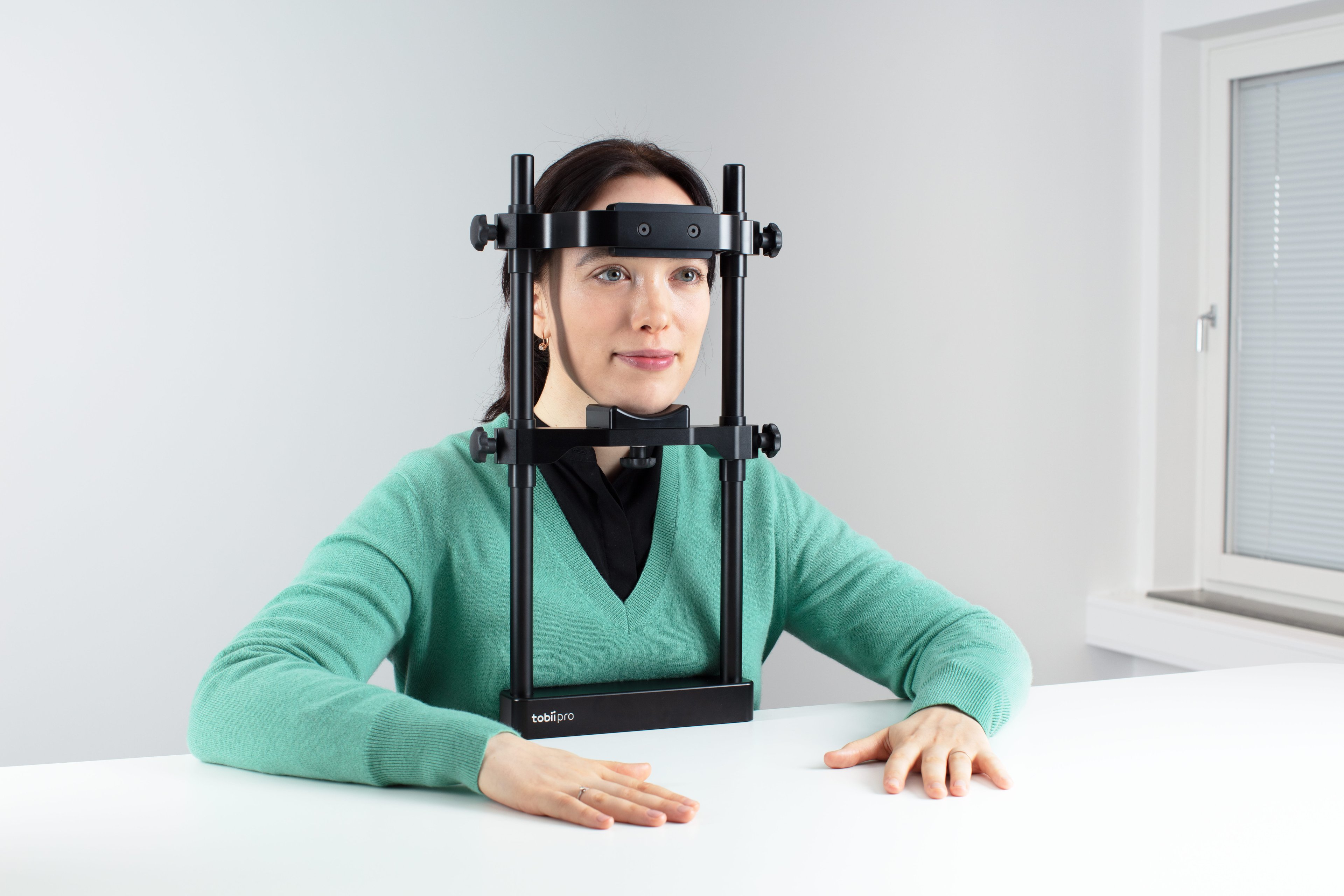 Person using Tobii Pro Chin Rest - Reading accessory