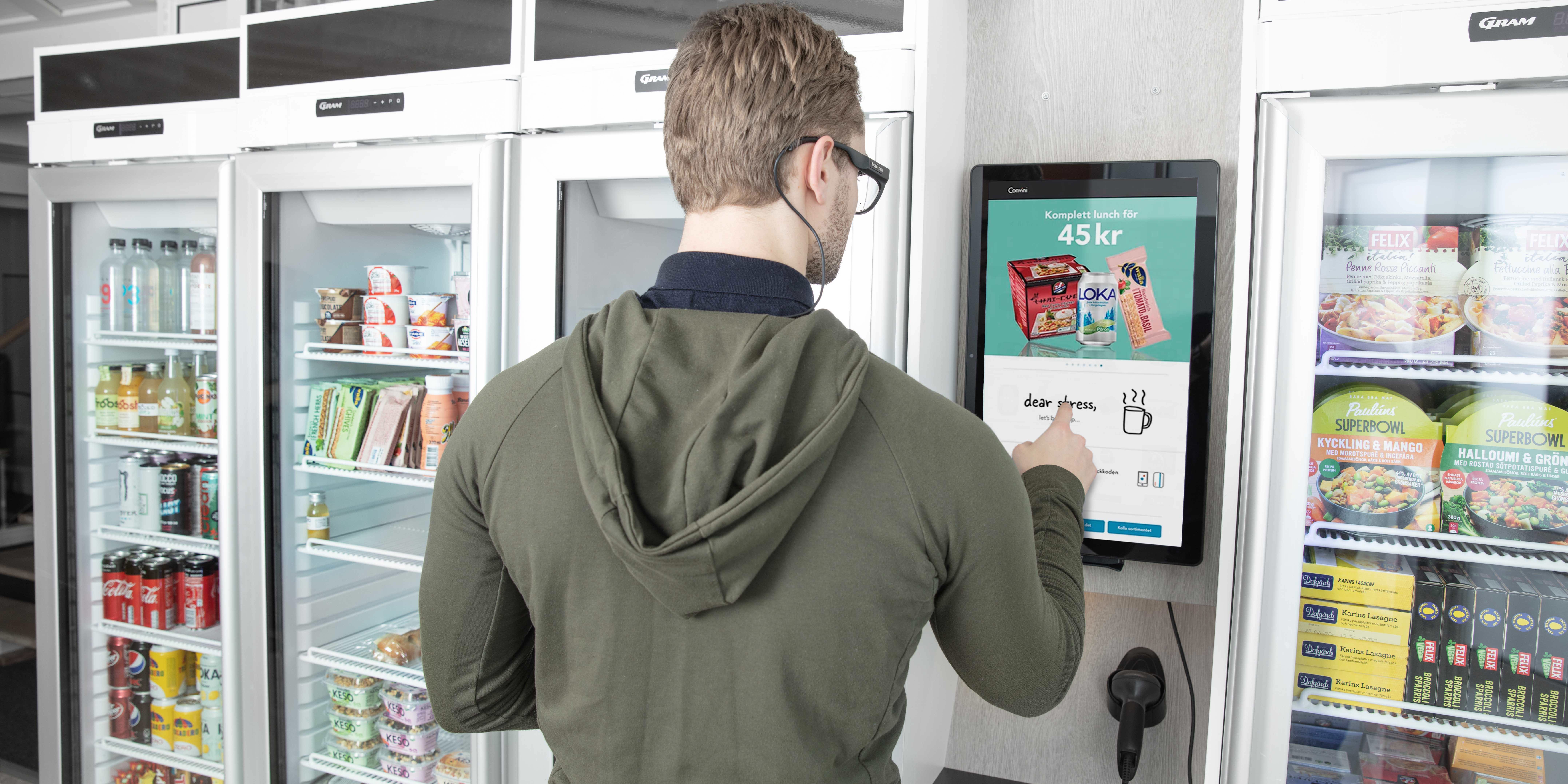 Man wearing Glasses 3 to purchase vending machine food