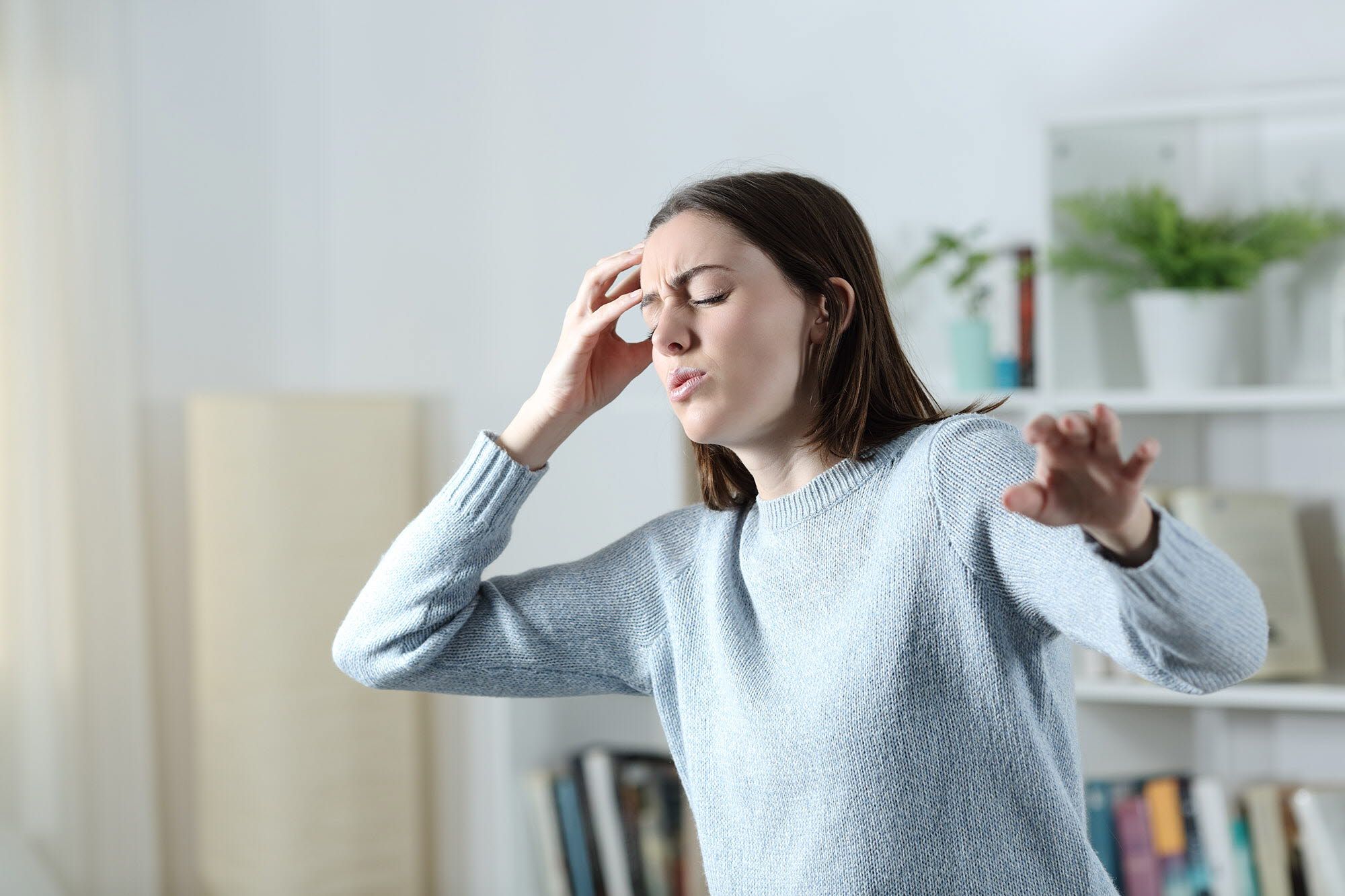 Woman experiencing vertigo